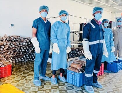 The team in hygiene gear with substrate bags at the unit